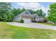 Landscaped home with a long driveway leading to a two-car garage and beautiful lawn at 968 Autumn Glen Ct, Clover, SC 29710