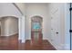 Hallway with hardwood floors, decorative arches, and ample natural light at 968 Autumn Glen Ct, Clover, SC 29710