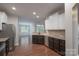 Eat in kitchen boasting stainless steel appliances, dark cabinets, and beautiful granite countertops at 968 Autumn Glen Ct, Clover, SC 29710