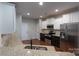 Well-equipped kitchen featuring stainless steel appliances, granite counters, and white cabinets at 968 Autumn Glen Ct, Clover, SC 29710