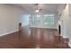 Open-concept living room featuring hardwood floors, fireplace, and lots of natural light at 968 Autumn Glen Ct, Clover, SC 29710