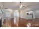 Spacious living room featuring hardwood floors, a ceiling fan, and an open floor plan to the kitchen at 968 Autumn Glen Ct, Clover, SC 29710