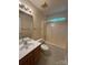 Bright bathroom with tub-shower combination and a single sink vanity at 978 Stinson Glen Ln, Charlotte, NC 28214
