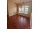 Well-lit dining room offers great natural light and hardwood floors at 978 Stinson Glen Ln, Charlotte, NC 28214