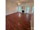 Bright living area boasts wood floors, a fireplace, and seamless access to the kitchen at 978 Stinson Glen Ln, Charlotte, NC 28214