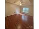 Spacious main bedroom featuring a ceiling fan and ample natural light at 978 Stinson Glen Ln, Charlotte, NC 28214
