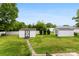 Large backyard featuring well-maintained lawn and storage sheds at 102 Sussex Ave, Cherryville, NC 28021