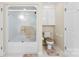 Bathroom featuring a shower with glass doors and a nearby toilet and storage cabinet at 102 Sussex Ave, Cherryville, NC 28021