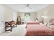Inviting bedroom with twin beds, ceiling fan, and cottage-style decor at 102 Sussex Ave, Cherryville, NC 28021