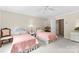 Charming bedroom with ceiling fan, twin beds, and cottage-style furnishings at 102 Sussex Ave, Cherryville, NC 28021