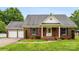 Charming single-story brick home with a well-manicured lawn and two-car garage at 102 Sussex Ave, Cherryville, NC 28021