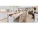 Open concept kitchen with a large island and seating for Gathering meals at 102 Sussex Ave, Cherryville, NC 28021