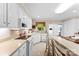 Bright kitchen with white cabinets, countertops, and modern appliances at 102 Sussex Ave, Cherryville, NC 28021