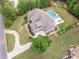 Aerial view of home featuring a swimming pool, multiple car garage, and circular driveway at 1045 Spyglass Ln, Waxhaw, NC 28173
