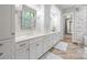 Elegant bathroom with double vanity, white cabinets, and modern fixtures at 1045 Spyglass Ln, Waxhaw, NC 28173