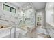 Luxurious bathroom featuring a soaking tub, glass-enclosed shower, and marble accents at 1045 Spyglass Ln, Waxhaw, NC 28173