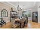 Charming dining room featuring a wooden table, chandelier, and stylish decor with a wine refrigerator at 1045 Spyglass Ln, Waxhaw, NC 28173