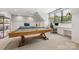 Spacious game room featuring a pool table, built-in desk area, and ample natural light at 1045 Spyglass Ln, Waxhaw, NC 28173