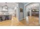 Modern kitchen with white cabinetry, stainless steel appliances, and an island with bar seating at 1045 Spyglass Ln, Waxhaw, NC 28173