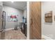 Well-equipped laundry room with brick floors, modern washer/dryer, and ample storage at 1045 Spyglass Ln, Waxhaw, NC 28173