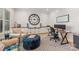 Bright office with shiplap walls, built-in cabinets, a desk, a comfortable chair and an accent ottoman at 1045 Spyglass Ln, Waxhaw, NC 28173
