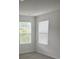 Corner bedroom featuring gray carpet and two windows at 113 Stoney Ln, Cherryville, NC 28021