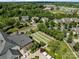 Aerial view of the community with bocce courts, clubhouse, and green space at 11621 Mount Argus Dr, Cornelius, NC 28031