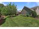 Well-maintained backyard includes a patio with pergola and lush greenery at 11621 Mount Argus Dr, Cornelius, NC 28031