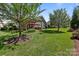 Expansive backyard showcases a patio with pergola and manicured lawn at 11621 Mount Argus Dr, Cornelius, NC 28031