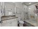 Bathroom boasts a glass shower with marble surround, vanity, and storage at 11621 Mount Argus Dr, Cornelius, NC 28031