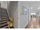 Hallway view featuring a stair lift and access to the kitchen at 11621 Mount Argus Dr, Cornelius, NC 28031