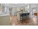 Open-concept kitchen with granite countertops, stainless steel appliances, and a breakfast bar for casual dining at 11621 Mount Argus Dr, Cornelius, NC 28031