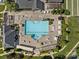 Aerial view of a large community pool with lounge chairs, tables, and landscaped areas at 11621 Mount Argus Dr, Cornelius, NC 28031