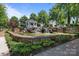 Serene water feature with stone cascades, lush landscaping, and a charming gazebo at 11621 Mount Argus Dr, Cornelius, NC 28031