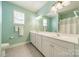 Bright bathroom with double vanity, white cabinets, and plenty of counter space at 13360 Old Compton Ct, Pineville, NC 28134