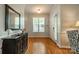 Welcoming entryway with hardwood floors, wainscoting, and a decorative mirror at 13360 Old Compton Ct, Pineville, NC 28134