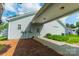Exterior view of home featuring covered driveway and mature landscaping at 13360 Old Compton Ct, Pineville, NC 28134