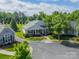 Aerial view showing the exterior of the house with manicured lawn and mature trees at 13360 Old Compton Ct, Pineville, NC 28134