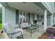 Relaxing front porch features comfortable seating and inviting outdoor decor at 13360 Old Compton Ct, Pineville, NC 28134