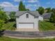 Detached two-car garage and driveway, surrounded by well-manicured lawn at 13360 Old Compton Ct, Pineville, NC 28134