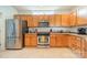 Functional kitchen with stainless steel appliances and ample cabinet space at 13360 Old Compton Ct, Pineville, NC 28134