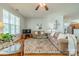 Comfortable living room with hardwood floors, ceiling fan, and neutral decor at 13360 Old Compton Ct, Pineville, NC 28134