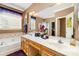 Relaxing bathroom with dual sinks, soaking tub, walk-in shower and a large mirror for grooming at 13406 Ada Ct, Charlotte, NC 28213