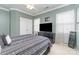 Well-lit bedroom with crown molding, ceiling fan, and natural light streaming through large windows at 13406 Ada Ct, Charlotte, NC 28213