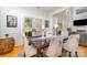 Inviting dining room with access to the outdoor patio through elegant glass doors at 13406 Ada Ct, Charlotte, NC 28213