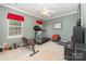 Functional exercise room with treadmill, weight bench and natural light at 13406 Ada Ct, Charlotte, NC 28213