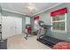 Well-equipped exercise room with a treadmill and weight bench at 13406 Ada Ct, Charlotte, NC 28213