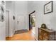 Welcoming foyer featuring wood floors, natural light, and a neutral color palette at 13406 Ada Ct, Charlotte, NC 28213