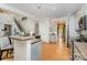 Spacious kitchen with a breakfast bar, stainless steel appliances, and hardwood floors at 13406 Ada Ct, Charlotte, NC 28213