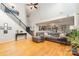 Open-concept living room with hardwood floors, vaulted ceilings, and a view of the kitchen at 13406 Ada Ct, Charlotte, NC 28213